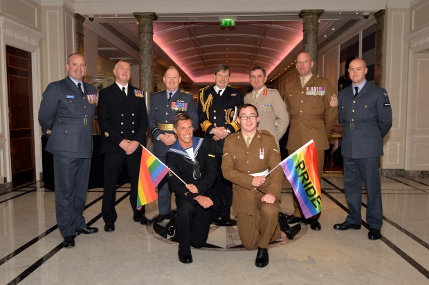 Second Sea Lord Jonathan Woodcock (centre rear), flanked by Air Vce Marshal David Stubbs (to left) and Lieutenant General James Everard (to right) with the Warrant Officers of the three services and personnel from the services contingents prior to the London Community Pride parade. Armed Forces March in London Pride 270615 The Armed Forces marched through the streets of London today on Armed Forces Day as part of the London Community Pride parade. Prior to the event participants met with the Minister of the Armed Forces Penny Mordaunt MP and the Minister for Equalities Incumbent Caroline Dinenage MP as well as a number of Senior Military Officers at the Hyatt Regency Hotel in London. Image taken by LA(Phot) Simmo Simpson, FRPU(E), Royal Navy. Consent forms where required held by FRPU(E), HMS Excellent.